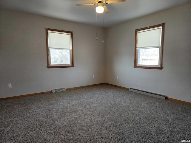 empty room with a baseboard heating unit, ceiling fan, and carpet flooring