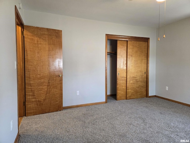 unfurnished bedroom with carpet and a closet