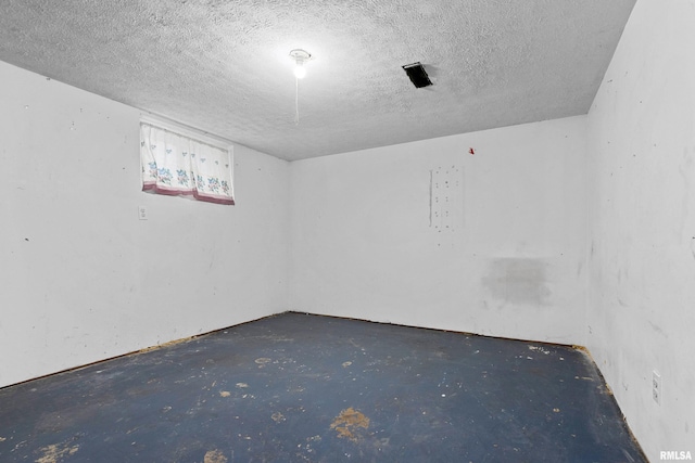 spare room featuring a textured ceiling