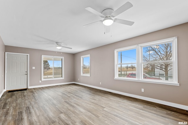 interior space featuring ceiling fan and light hardwood / wood-style floors