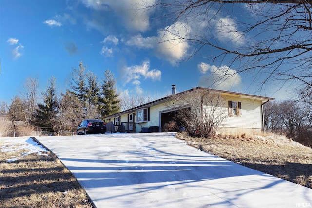 view of front of property with a garage