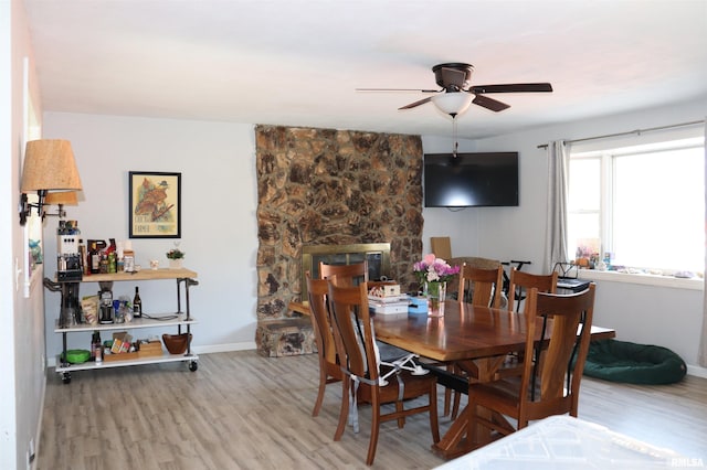 dining space featuring ceiling fan and wood-type flooring