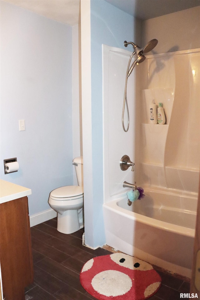 full bathroom with hardwood / wood-style flooring, shower / bathing tub combination, vanity, and toilet