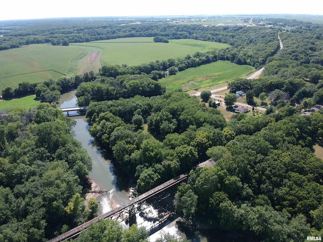 drone / aerial view with a rural view and a water view