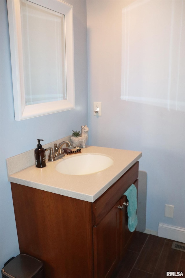 bathroom with wood-type flooring and vanity