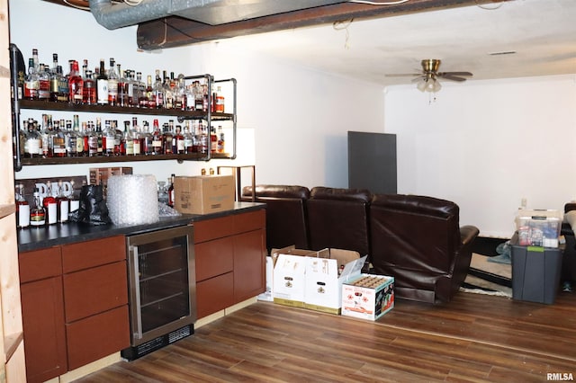 bar featuring ceiling fan, dark wood-type flooring, and wine cooler