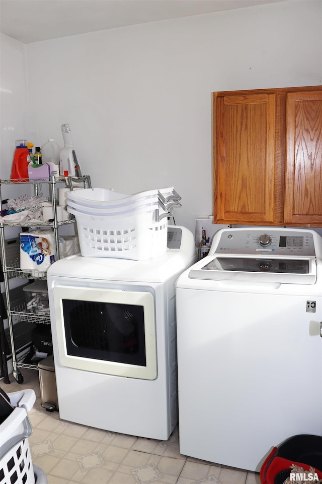 laundry area with cabinets and independent washer and dryer