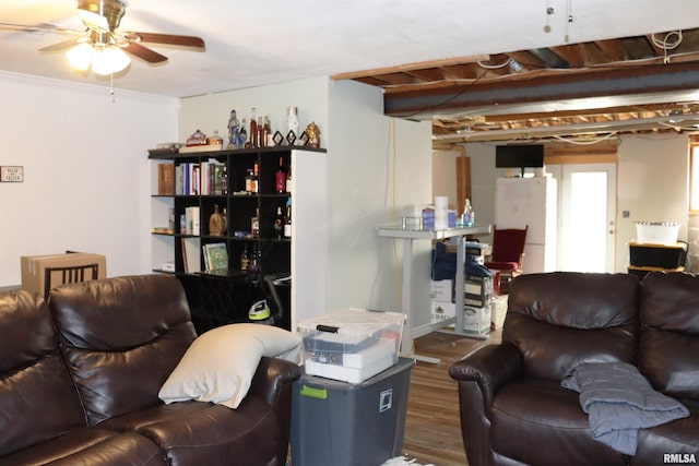 living room featuring hardwood / wood-style floors and ceiling fan