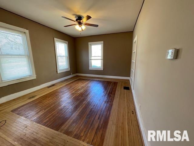 unfurnished room featuring ceiling fan and wood-type flooring