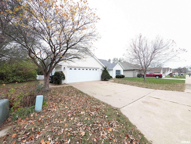 exterior space with driveway and an attached garage