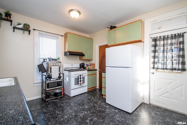 kitchen featuring white appliances, sink, and green cabinets