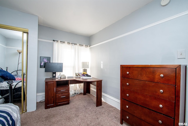 office space featuring baseboard heating and light colored carpet