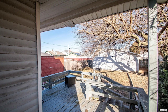 wooden deck with a storage unit