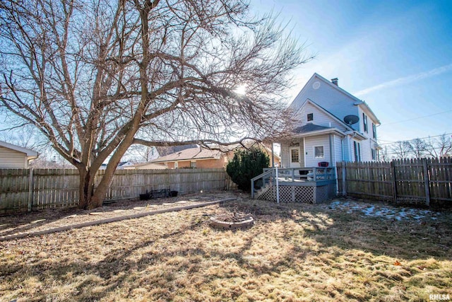 view of yard with a wooden deck