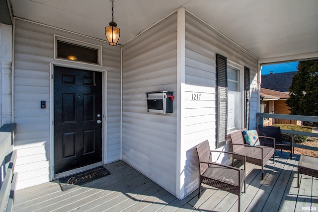 doorway to property with covered porch