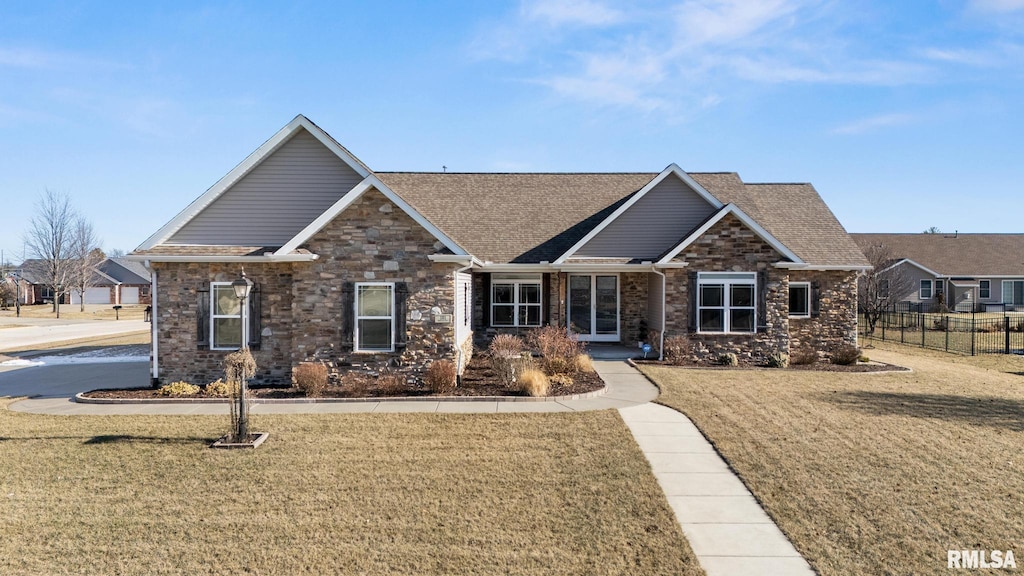 craftsman-style house featuring a front lawn