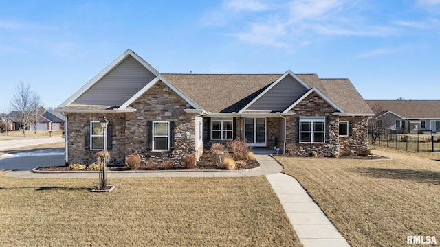 craftsman-style house featuring a front lawn