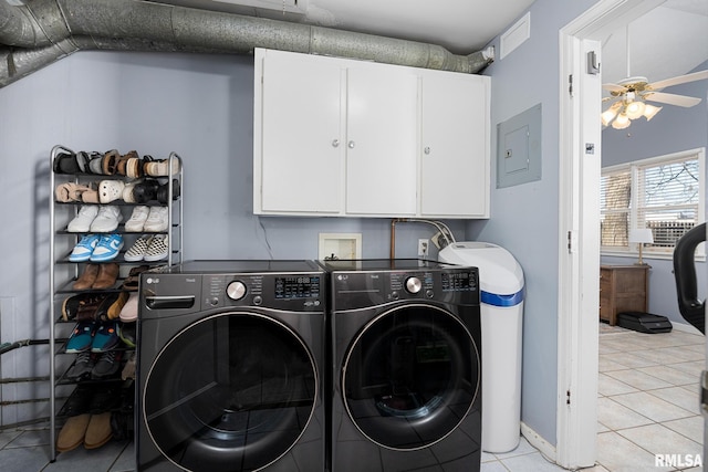 laundry area featuring cabinets, separate washer and dryer, light tile patterned floors, electric panel, and ceiling fan