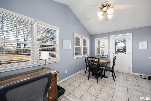 dining space with lofted ceiling, ceiling fan, and light tile patterned flooring