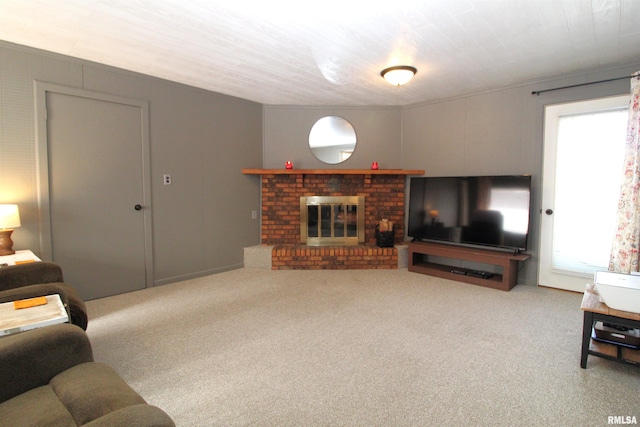 carpeted living room with a fireplace and a wealth of natural light