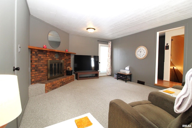 living room with carpet floors and a brick fireplace