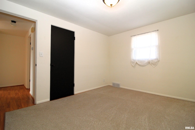 empty room featuring carpet flooring