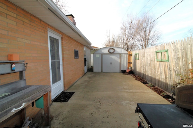 view of patio with a shed