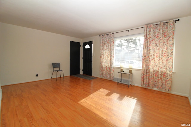 spare room featuring hardwood / wood-style flooring