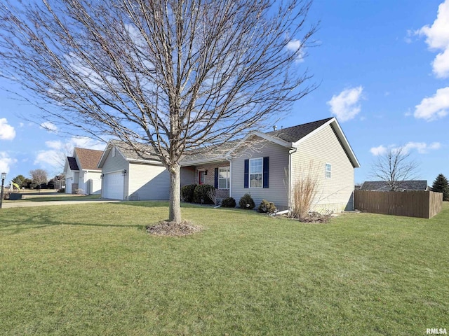 single story home featuring a garage and a front yard