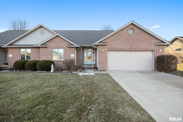 view of front of property featuring a garage and a front yard