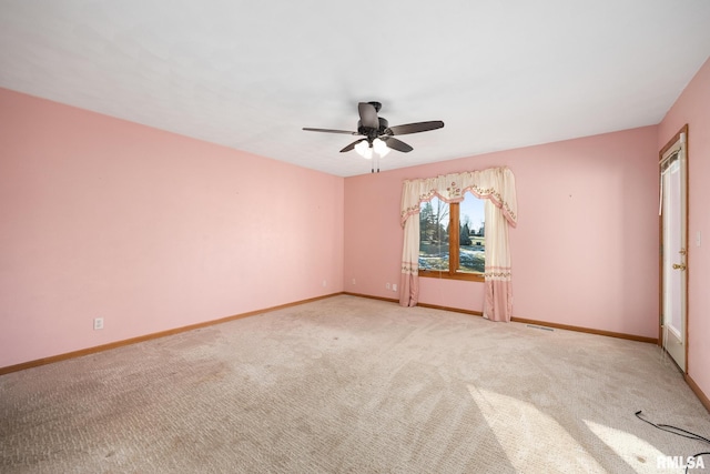 unfurnished room with ceiling fan and light carpet