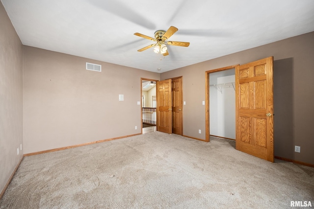 unfurnished bedroom featuring carpet floors and ceiling fan