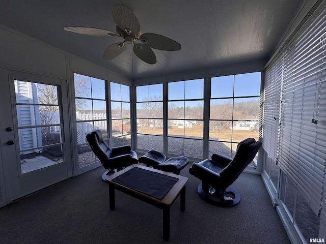 sunroom with ceiling fan