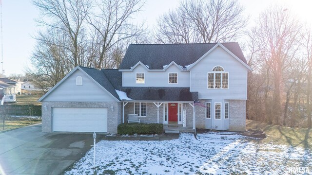 front of property with a garage