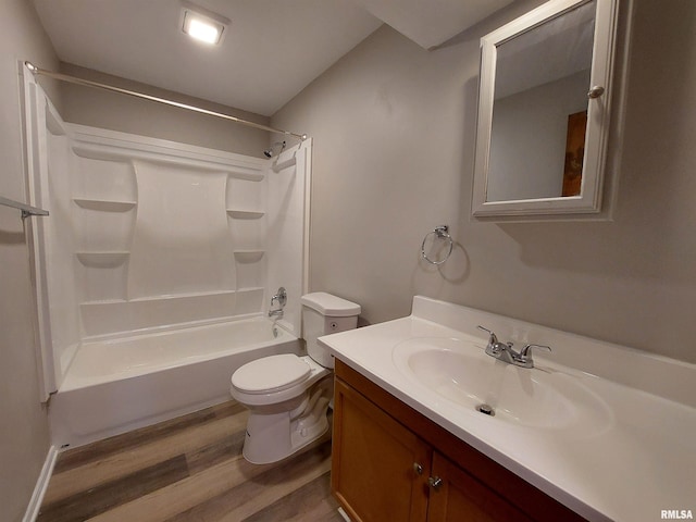 full bathroom featuring vanity, hardwood / wood-style flooring, tub / shower combination, and toilet