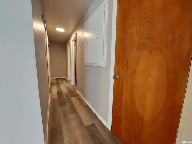 corridor featuring wood-type flooring