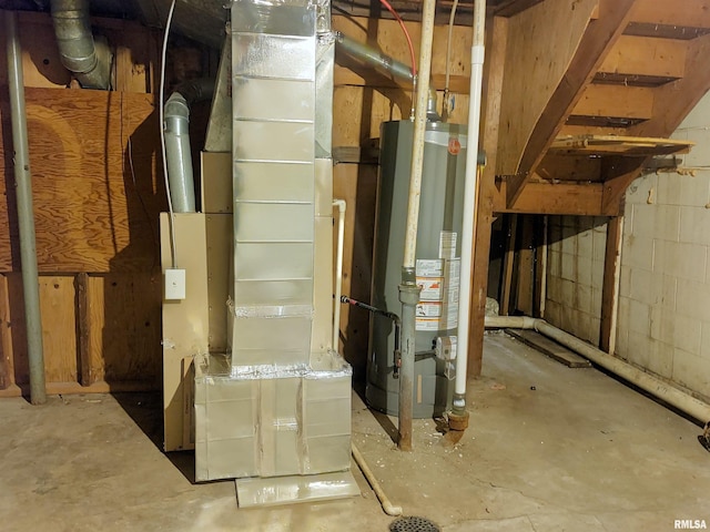 utility room featuring water heater