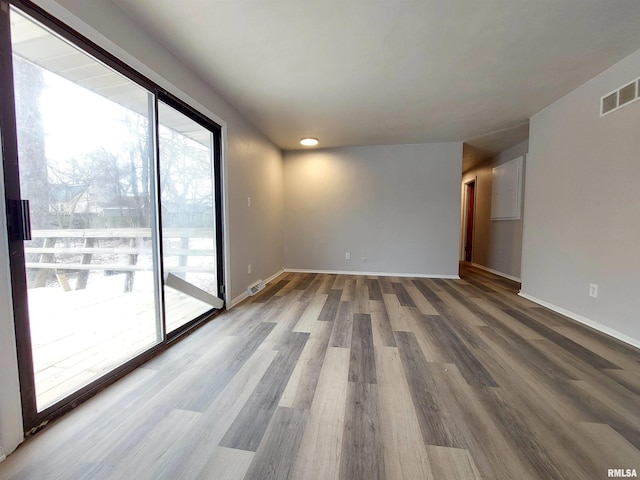 empty room featuring hardwood / wood-style flooring