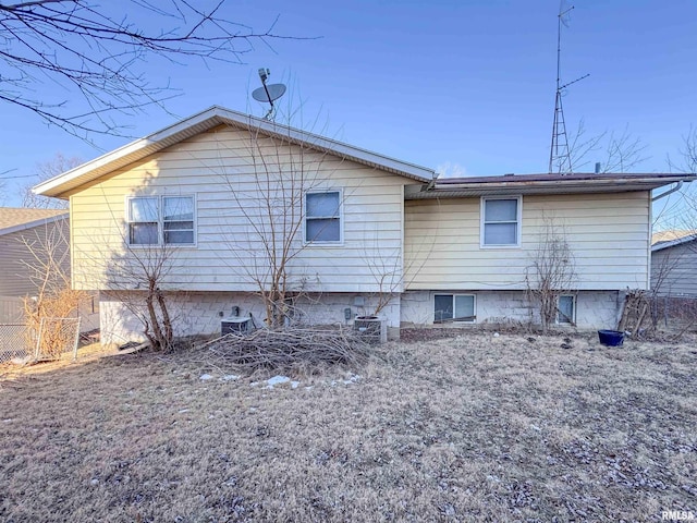 back of property featuring cooling unit