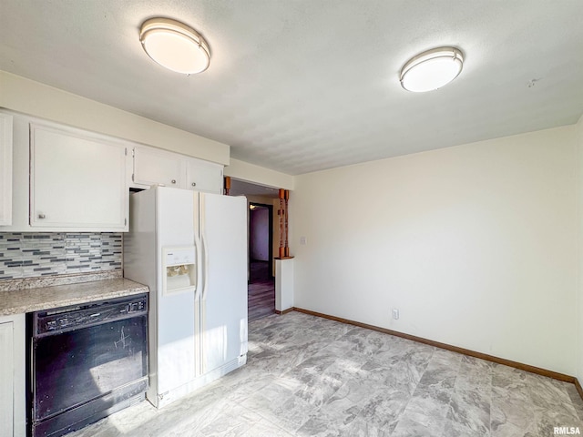 kitchen featuring white refrigerator with ice dispenser, dishwasher, light countertops, white cabinetry, and backsplash