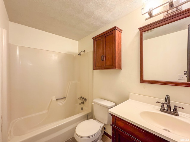 bathroom featuring bathing tub / shower combination, a textured ceiling, toilet, and vanity