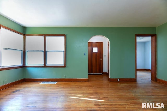 empty room featuring hardwood / wood-style flooring