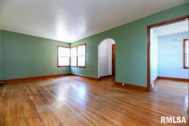 unfurnished room featuring hardwood / wood-style flooring