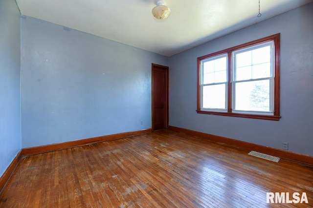 empty room featuring hardwood / wood-style floors