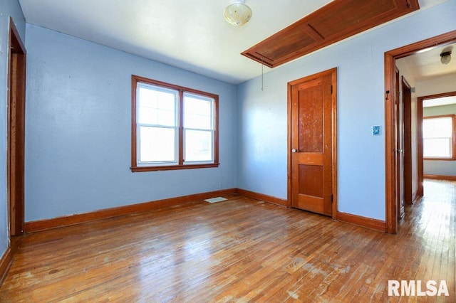 unfurnished bedroom with light wood-type flooring