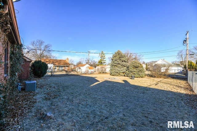 view of yard with central AC