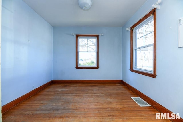 empty room featuring hardwood / wood-style floors