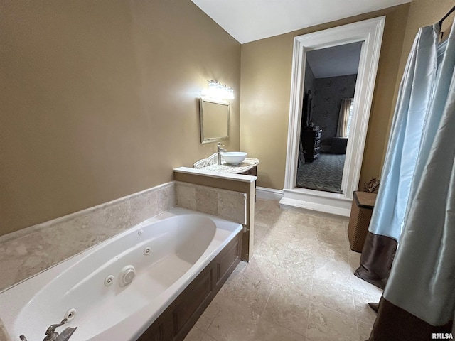 bathroom featuring a bathing tub and vanity