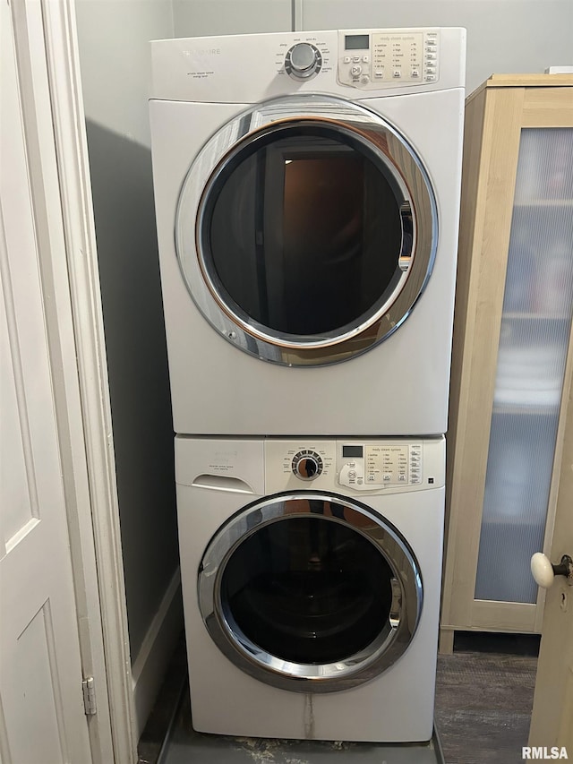 laundry area featuring stacked washing maching and dryer