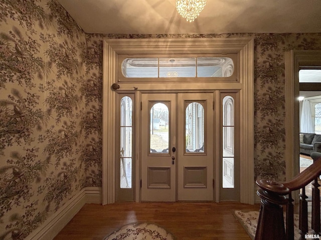 foyer featuring a notable chandelier and hardwood / wood-style flooring